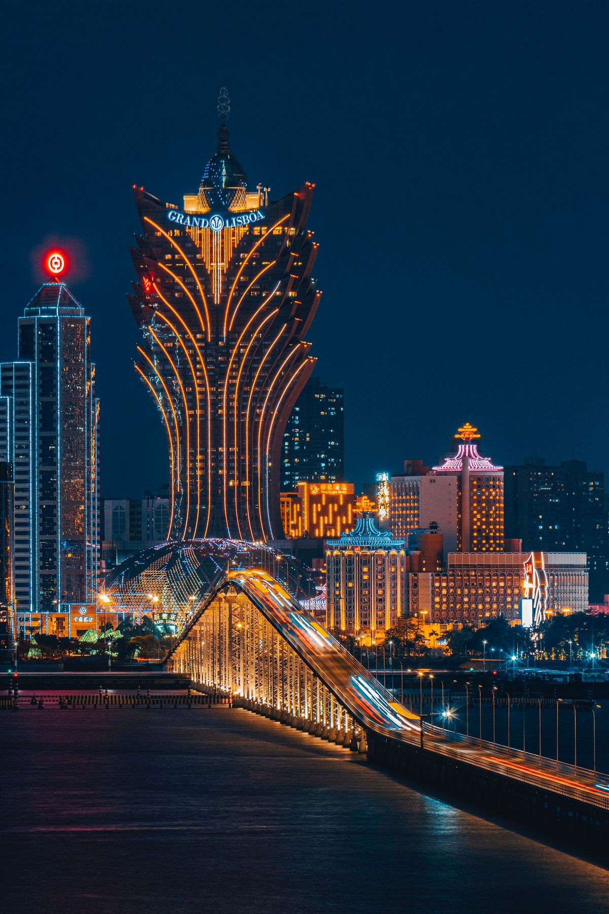 Macau's Grand Lisboa glowing at night after dark